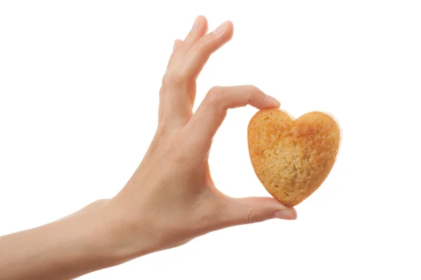 Hand holding heartshape cake — Stock Photo, Image