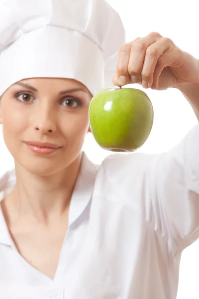 Smiling woman cook with green apple Stock Picture