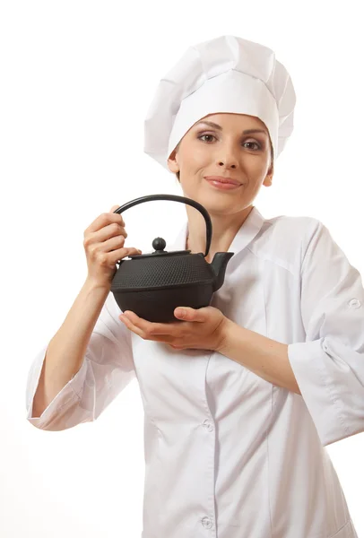 Female cook / chef in uniform with teapot — Stock Photo, Image