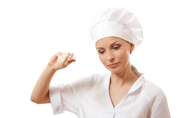 Mujer cocinera comiendo con cuchara, aislada en blanco —  Fotos de Stock