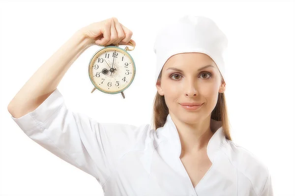 Vrouwelijke arts bedrijf alarm clock, geïsoleerd — Stockfoto