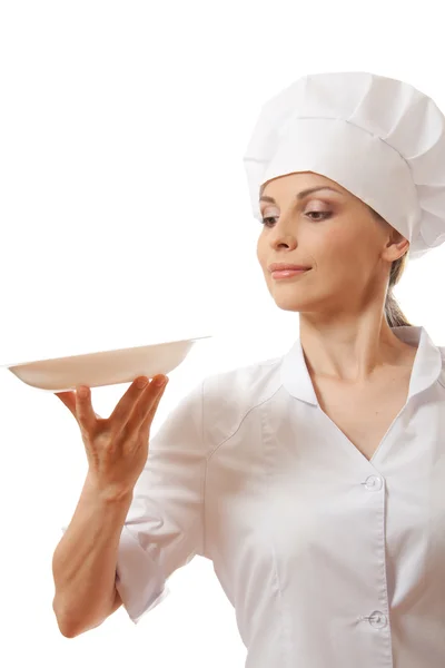 Μάγειρας γυναίκα, κρατώντας το άδειο πιάτο — Φωτογραφία Αρχείου