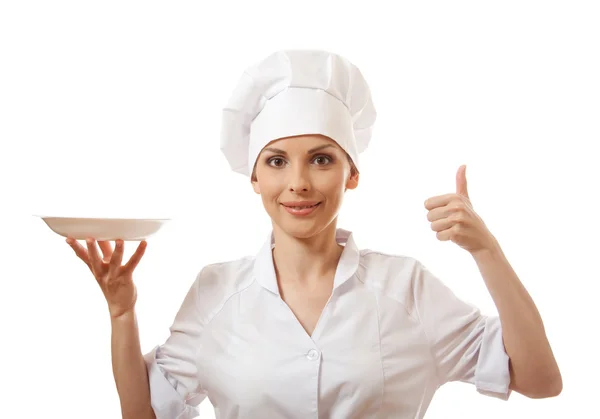 Woman cook holding empty plate — Stock Photo, Image