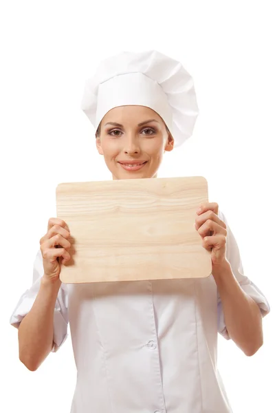 Vrouw chef-kok in uniform met snijplank, geïsoleerd — Stockfoto