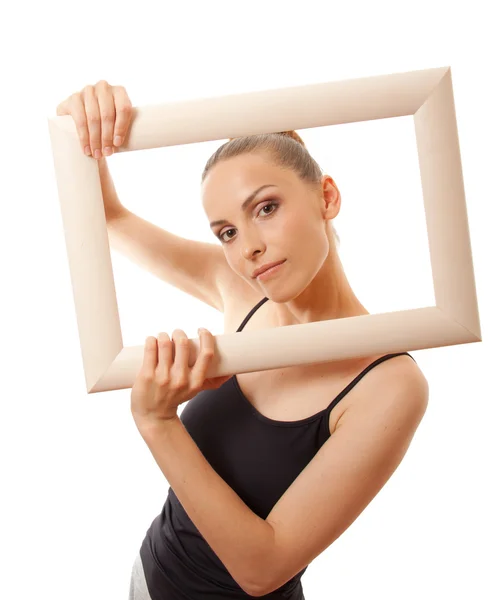 Mooie vrouw holding een frame en glimlachen — Stockfoto