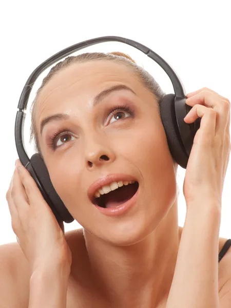 Woman listening music with headphones, on white — Stock Photo, Image