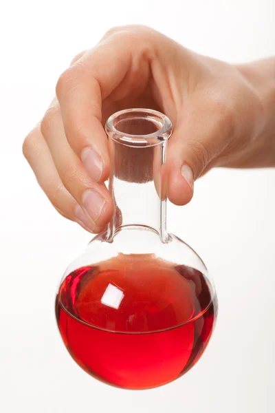 Mão com garrafa química isolada em branco — Fotografia de Stock