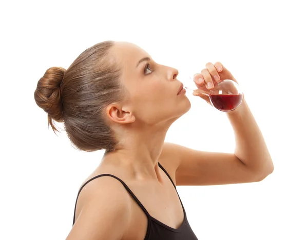 Woman drinking a red liquid — Stock Photo, Image