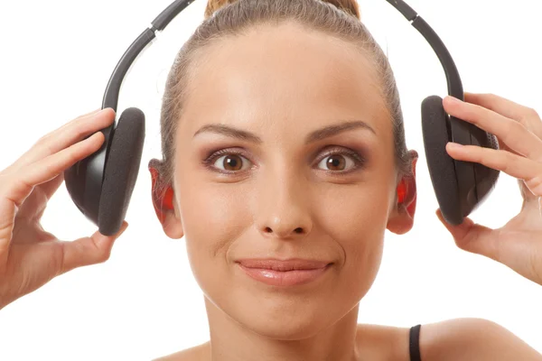 Woman listening music with headphones, on white — Stock Photo, Image