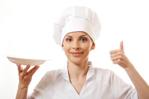 Mujer cocinar sosteniendo plato vacío — Foto de Stock