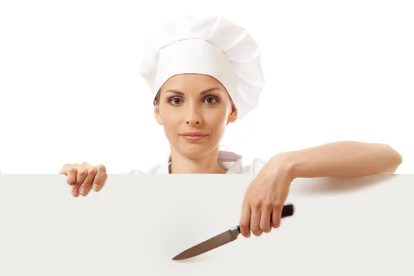 Chef mujer con tablero en blanco delante de ella —  Fotos de Stock