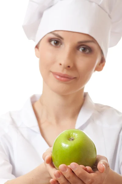 Mosolygó nő cook, zöld almával — Stock Fotó
