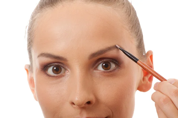 Vrij volwassen vrouw maken make-up — Stockfoto