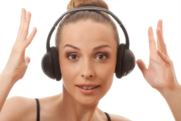 Woman listening music with headphones, on white — Stock Photo, Image