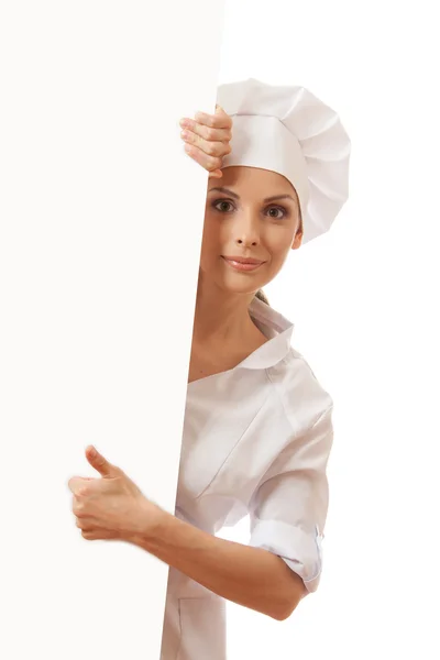 Chef mujer con tablero en blanco delante de ella — Foto de Stock