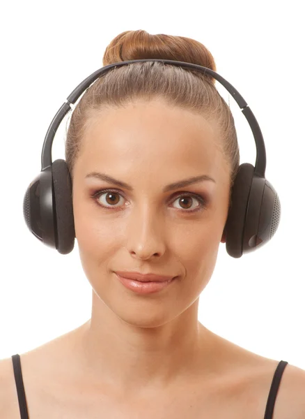 Woman listening music with headphones, on white — Stock Photo, Image