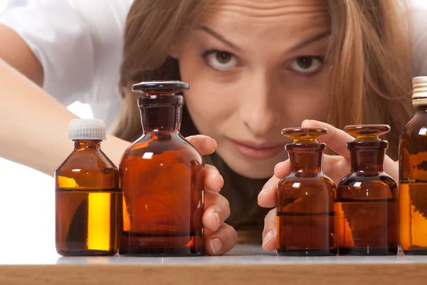 Woman doctor with medication in glass bottles — Stock Photo, Image