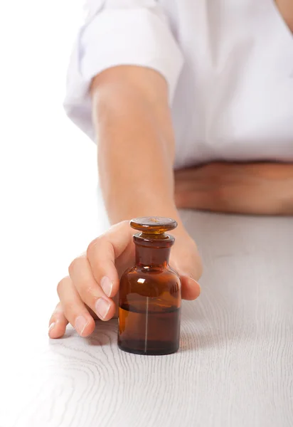 Hand with small bottle — Stock Photo, Image