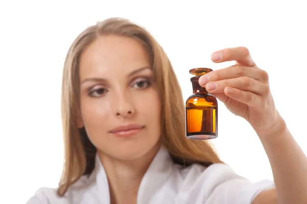 Woman doctor with medication in glass bottles — Stock Photo, Image