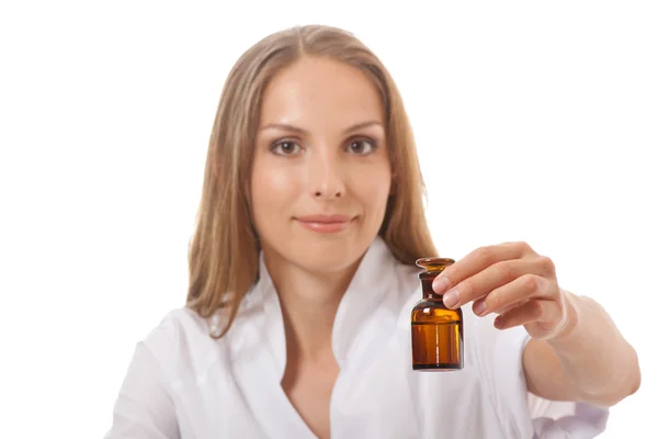 Woman doctor with medication in glass bottles — Stock Photo, Image