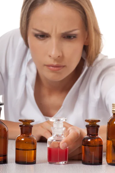 Woman doctor with medication in glass bottles — Stock Photo, Image