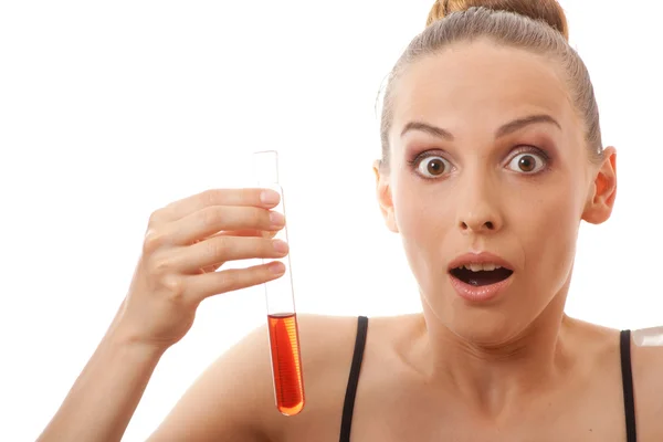 Woman holding test tube with red liquid — Stock Photo, Image