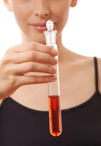 Woman holding test tube with red liquid — Stock Photo, Image