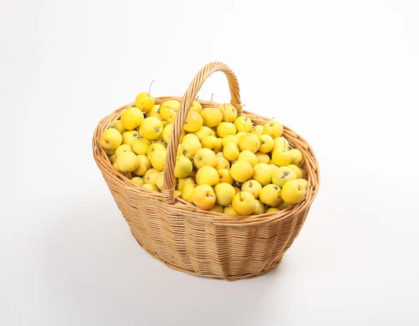 Yellow apples in a wicker basket — Stock Photo, Image