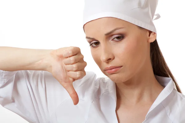 Female doctor showing thumbs down gesture — Stock Photo, Image