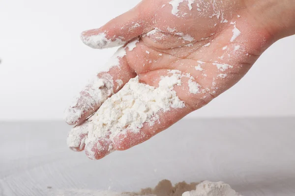 Hands and white wheat flour — Stock Photo, Image