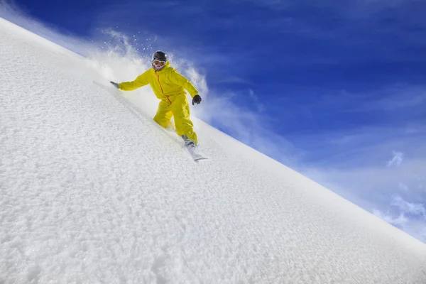 Snowboard rider moving down in snow powder — Stock Photo, Image