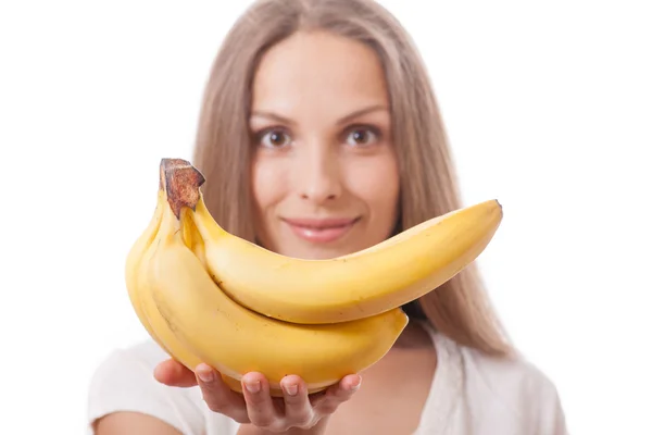 Young girl holding banana — Stock Photo, Image