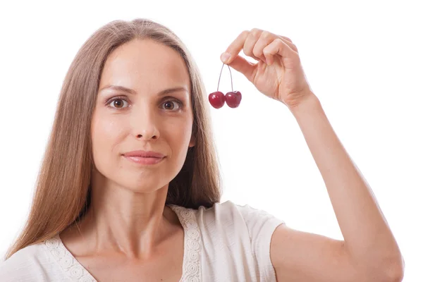 Mano sosteniendo dos cerezas frescas — Foto de Stock