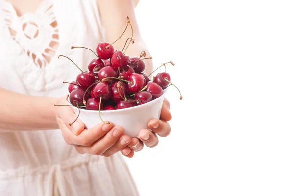 Bowl of cherries in womens hands — Stock Photo, Image