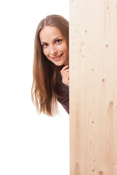 Mujer detrás de una tabla de madera — Foto de Stock