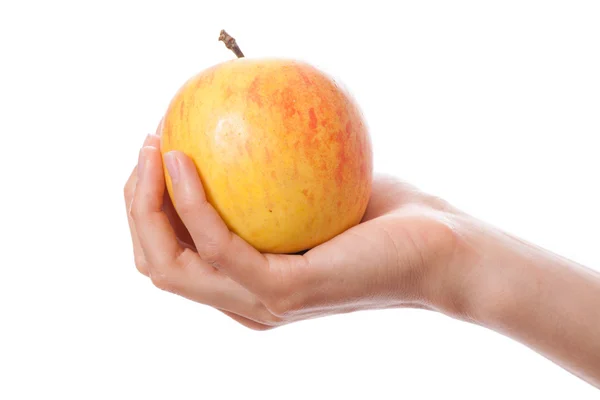 Pomme dans une main féminine — Photo