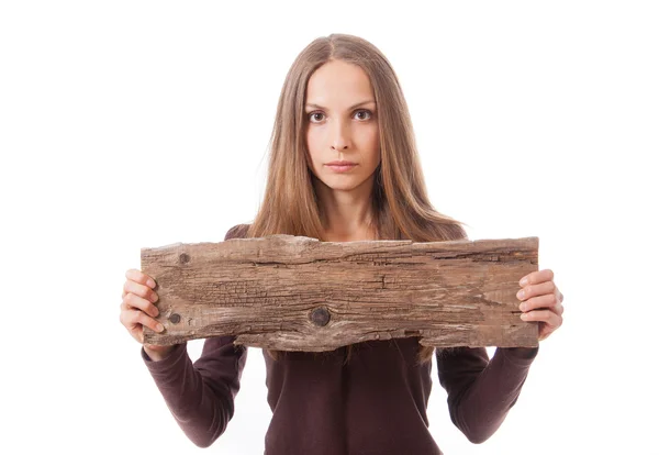 Vrouw bedrijf oude houten plank — Stockfoto