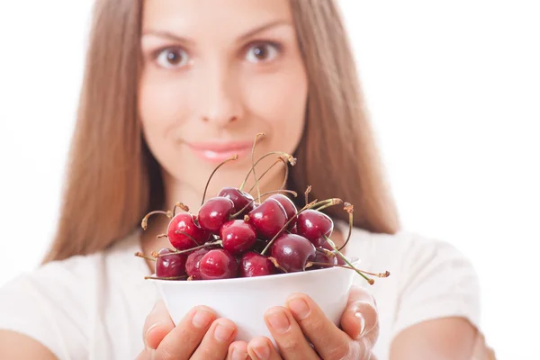 Bowl of cherries in womens hands — Stock Photo, Image