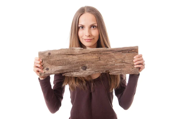 Vrouw bedrijf oude houten plank — Stockfoto