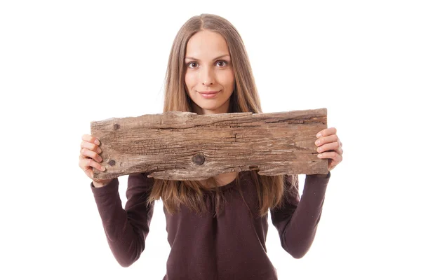 Femme tenant vieux panneau en bois — Photo