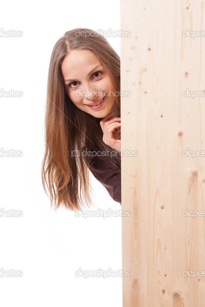 Woman behind a wooden board