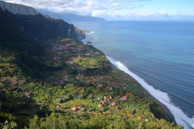 The spectacular North coast from Sao Jorge (and Arco de Sao Jorge) to Ponta Delgada viewed from the viewpoint Miradouro da Beira da Quinta, Madeira island, Portugal