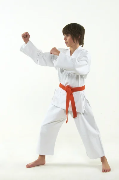 Boy practicing karate on white background — Stock Photo, Image