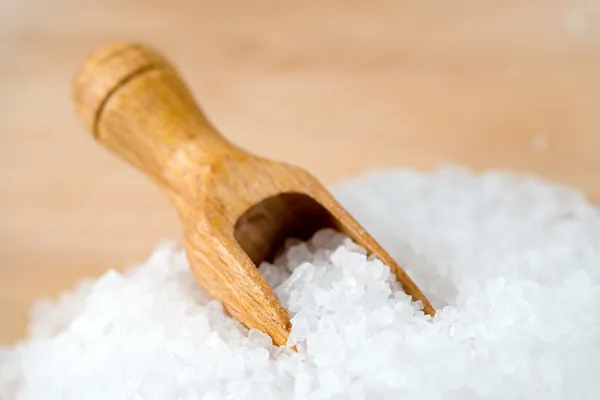 Salt with a spoon — Stock Photo, Image