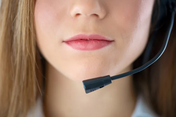 Woman mouth speaking in headset — Stock Photo, Image