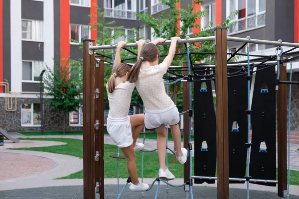 Kids Outdoors Having Fun Modern Playground New Colorful Equipment Sisterhood — 스톡 사진