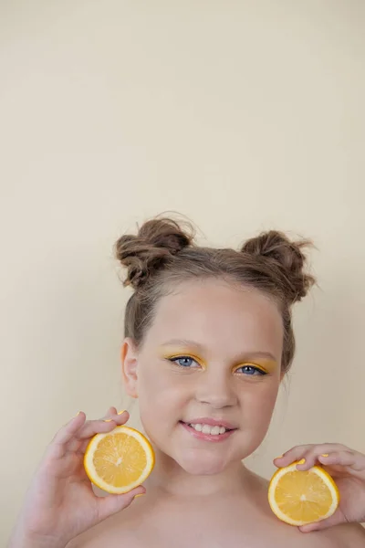 Charming Tween Girl Slices Ripe Lemon Yellow Background Juicy Fruit —  Fotos de Stock