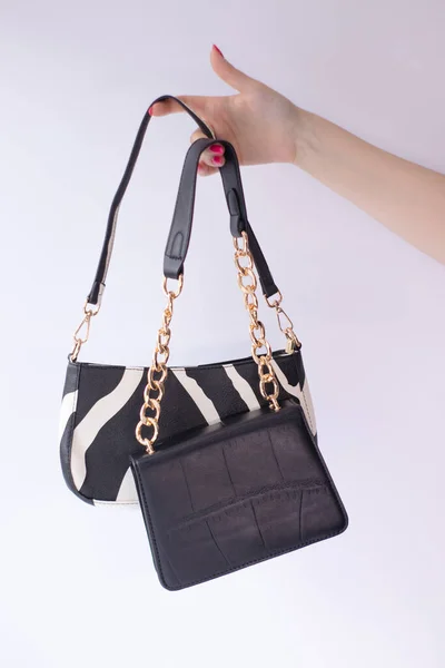 Close Womans Hand Holding Fashionable Little Black Bag Product Photography — Stockfoto