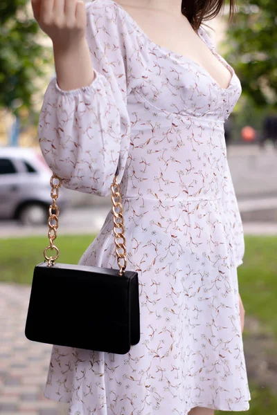 Close Womans Hand Holding Fashionable Little Black Bag Product Photography — Stockfoto