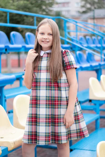 Pretty Girl School Dress Uniform Blue Yellow Tribune School Stadium —  Fotos de Stock